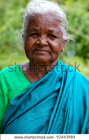 MUNNAR, INDIA - FEBRUARY 2: Unidentified elderly Indian woman in a sari on February 2, 2011 in Munnar, India. Munnar is located in the southern state of Kerala.