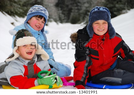 Happy children playing in snow