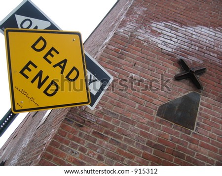 dead end  and one way sign and wall