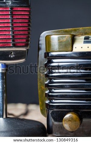 Vintage green bakelite radio with a vintage microphone off to the left