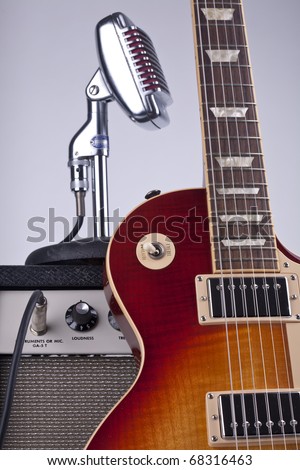Electric guitar with amp and vintage microphone