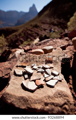 Pieces of broken indian pottery in the middle of the Grand Canyon along the Colorado River