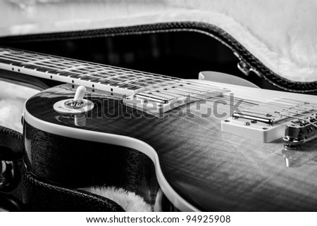 Black and White of a Beautiful Electric Guitar Laying in a Hard Shell Guitar Case
