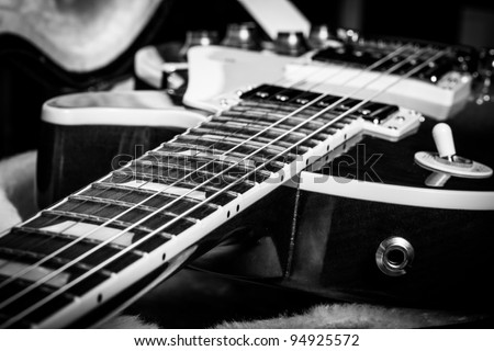 Black and White Close Up of an Electric Guitar Laying Inside a Guitar Case