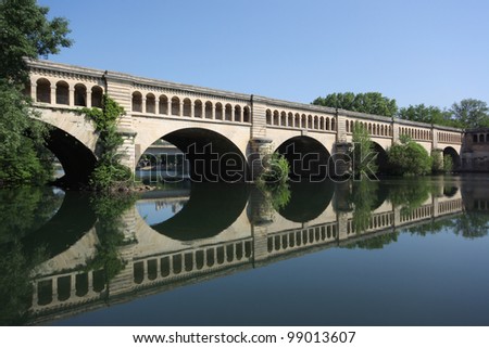The Orb Aqueduct, a bridge which carries the Canal du Midi over the Orb River in the city of Bezieres in Languedoc-Roussillon, France.