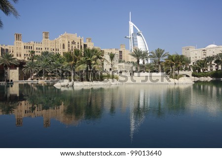 Madinat Jumeirah and the Tower of Arabs (Burj Al Arab) in Dubai reflecting in an artificial pool.