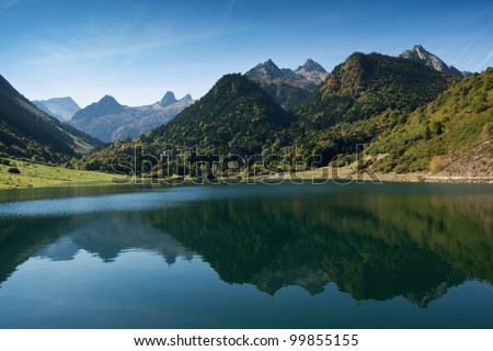 French Pyrenees reflecting in lake Lac Le Tech. Valley Arrens, Hautes-Pyrenees, France.