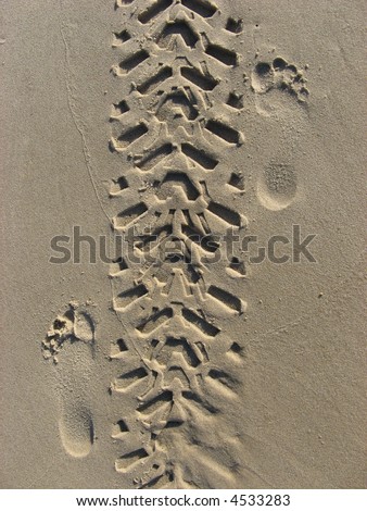 tire tread tracks path and foot footprints offroad off-road the track in the sand