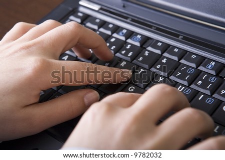 close up of woman hands typing in the laptop computer