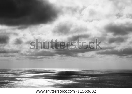 heavy thunderstorm with dark clouds over the ocean