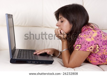 young woman with laptop computer in the sofa