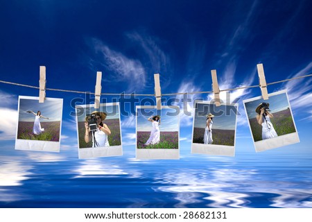 disposable photos frames hanging in the rope on a beautiful summer day - landscape orientation
