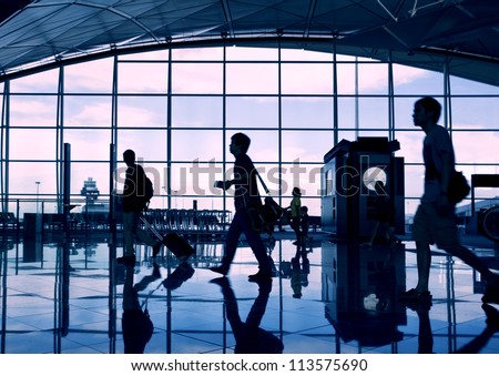 Airport Terminal Hall. Walking Travelers
