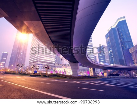 the light trails on the modern building background in shanghai c the light trails on the modern building background in shanghai c
