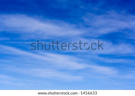 Blue sky and high level cirrus clouds