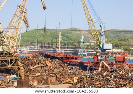 Recycling, loading scrap metal in the ship. Russia. Port of Nakhodka. Primorskiy Kray.