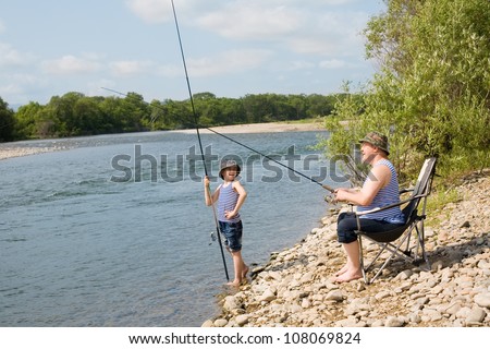 Grandfather and grandson go fishing on weekend.