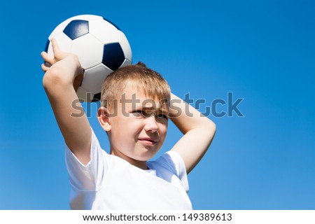 Boy throws a ball for football.