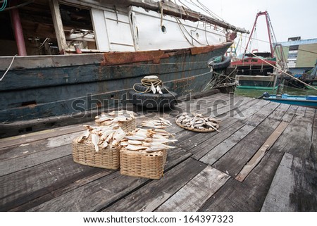 Dried fish on the pier at the fishing port of Macau. China.