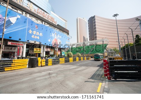 MACAU, CHINA - NOVEMBER 2, 2012: Safety barriers installed along streets before the upcoming racing Macau Grand Prix in stages Formula 3, FIA WTCC, motorcycle prize. Race takes place on the streets.