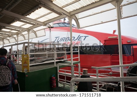 MACAU, CHINA - NOVEMBER 4, 2012: Fast passenger ferry hydrofoil Turbojet at berth marine terminal  Macau. Ferries run between Macau and Hong Kong, and mainland China.