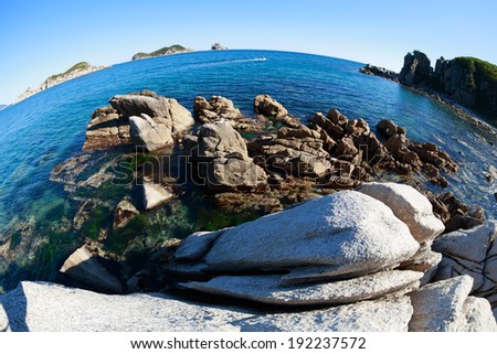Summer landscape of rocky sea coast. Japan sea. Fish-eye lens.
