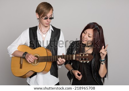 Young couple in dance music. Interracial young couple, Asian woman and Caucasian man.