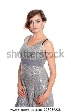 Beautiful woman in a shiny gray dress. Woman 36 years