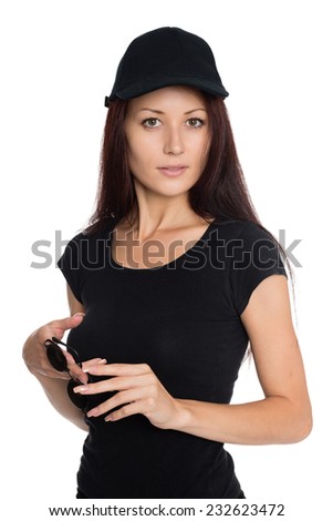 Beautiful young woman in a black baseball cap. Girl of twenty-seven years.