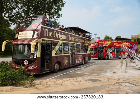 SINGAPORE - JANUARY 26, 2015: Singapore has over 10 million visitors each year. The Original Tour Singapore Sightseeing and Hippo City Sightseeing - this companies offering Singapore City bus tours.