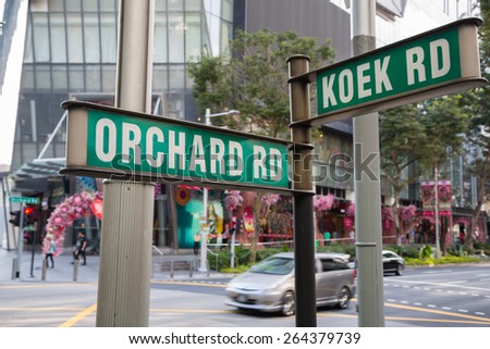 Street signs that says Orchard Road and Koek Road, Singapore.
