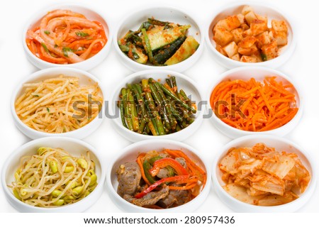 Spicy salads of traditional Korean cuisine: soy sprouts, bamboo shoots, chicken ventricles, chimchi, raw potatoes, carrots, boiled squid, cucumbers and zucchini.
