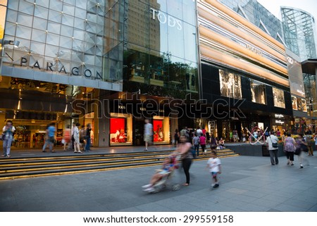 SINGAPORE - CIRCA FEBRUARY, 2015: People walk the Orchard Road - is a 2.2 kilometre long boulevard that is the retail and entertainment hub of Singapore. It is a huge tourist attraction, evening.