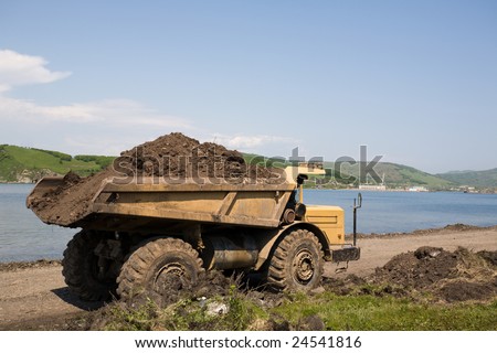 dump truck on a background of the sea