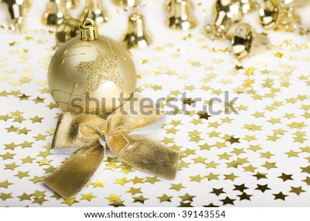 Gold decoration Christmas Ball and stars, handbells, bow.
