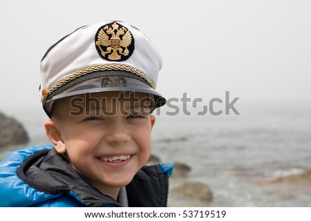 Little ship boy. Sea. Six years. Fog. At the cap emblem Russia.