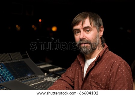 Sound engineer for sound mixer console in a nightclub.