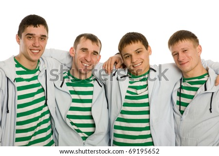 Four best friends, hugging and smiling. Isolated on white.
