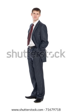 Handsome young businessman with a slight smile on his face.