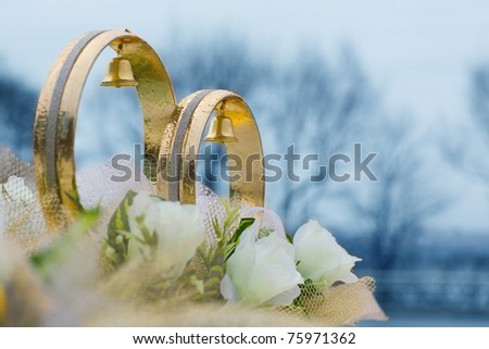 stock photo Wedding rings and flowers decorative on the roof of the car