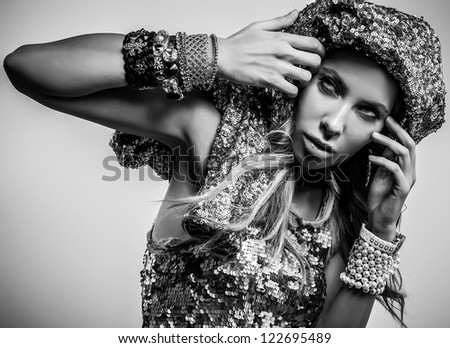 Luxury & beauty woman in a fashionable clothes. Black-white studio fashion photo.