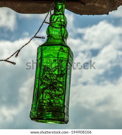 Old bottle as lamp.