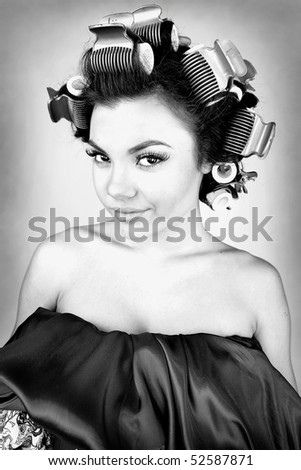 Emotional Girl with hair-curlers on her head. Black&White Photo.