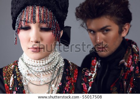 Pair models in exclusive design clothes on manners old-slavic. Photo.
