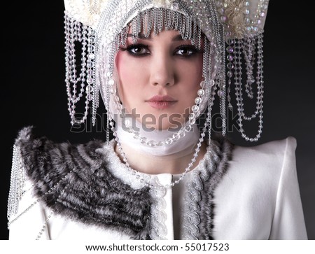 Portrait of Attractive model in exclusive design clothes on manners old-slavic.
