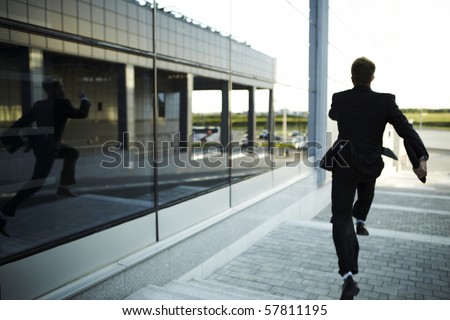 stressed businessman running away