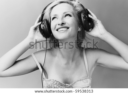 Sexy blond model Listens to music.