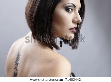 girl with tattoo. a pretty girl with tattoo