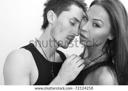 Young beautiful couple in love. Black-white close-up portrait.