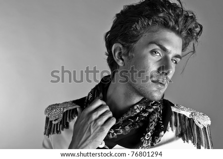 Beautiful man in exclusive design clothes on manners old-slavic. Black-white Photo.